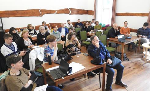 A picture showing a room full of participants attentively listening to the presentation at the Policy Lab workshop in Budapest.