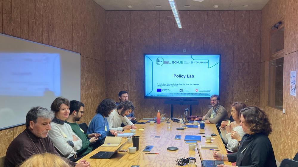 A room filled with participants taking notes at the workshop