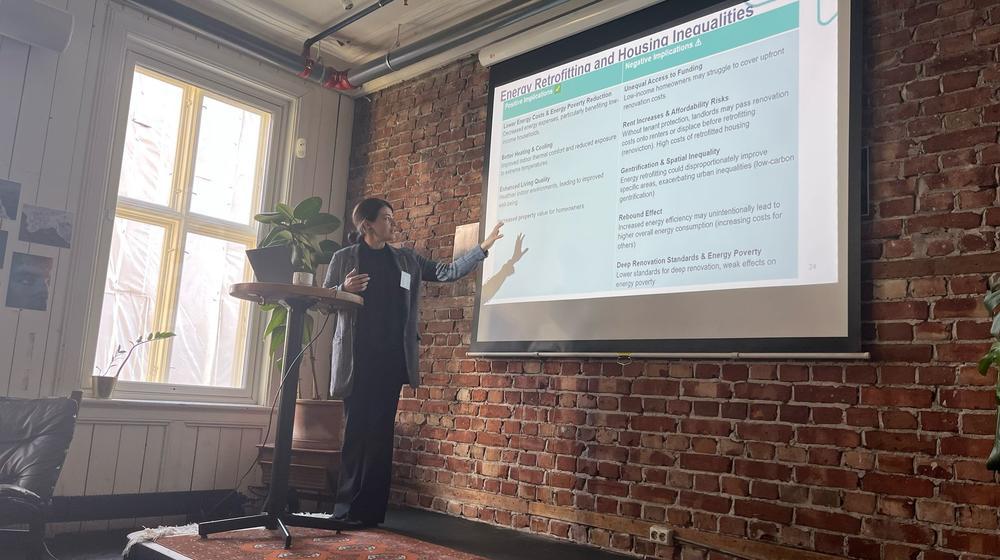 A researcher is giving a presentation at the ReHousIn Policy Lab workshop in Oslo